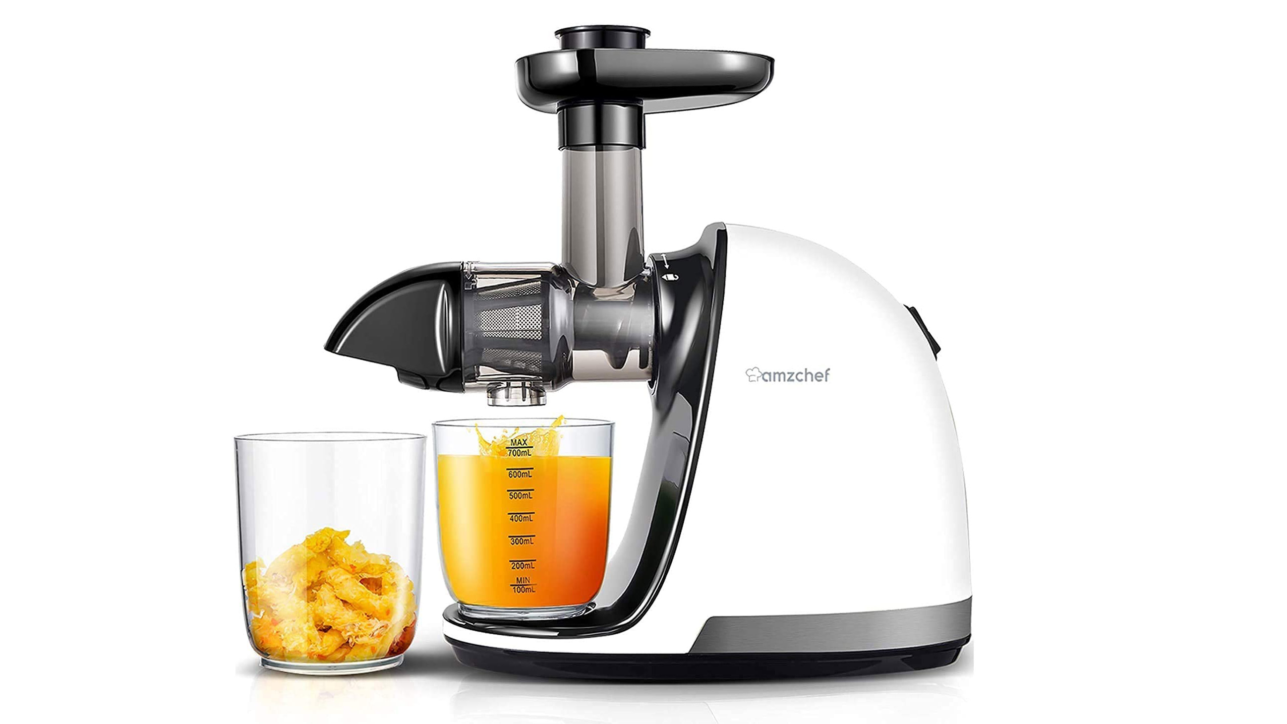 Amzchef ZM150 slow juicer on a white background with some freshly squeezed orange juice and discarded pulp