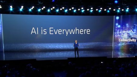 AMD CEO Dr. Lisa Su on stage with 'AI is everywhere' in the background.