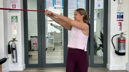 Woman performing a resistance band core workout