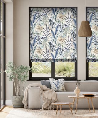 Botanical blue and stone colored Roman blinds in lounge