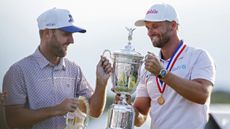 Wyndham Clark and his caddie with the US Open trophy