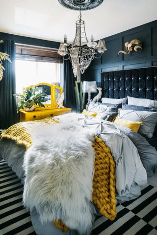 DIY makeover bedroom with dark headboard and yellow knit cover