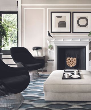 A black and white living room with a fireplace