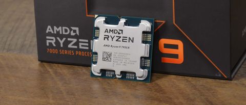 An AMD Ryzen 9 7950X on a table in front of its retail packaging
