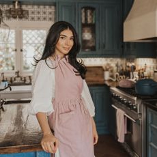 Our Place founder, Shiza Shahid in her blue kitchen in her Los Angeles home