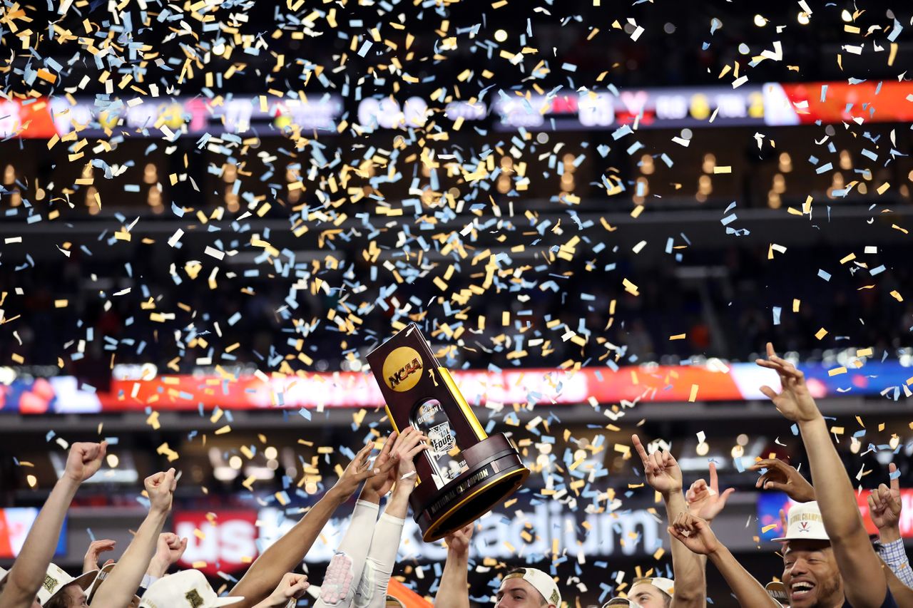 The Virginia Cavaliers hoist their NCAA trophy