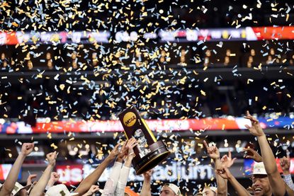The Virginia Cavaliers hoist their NCAA trophy