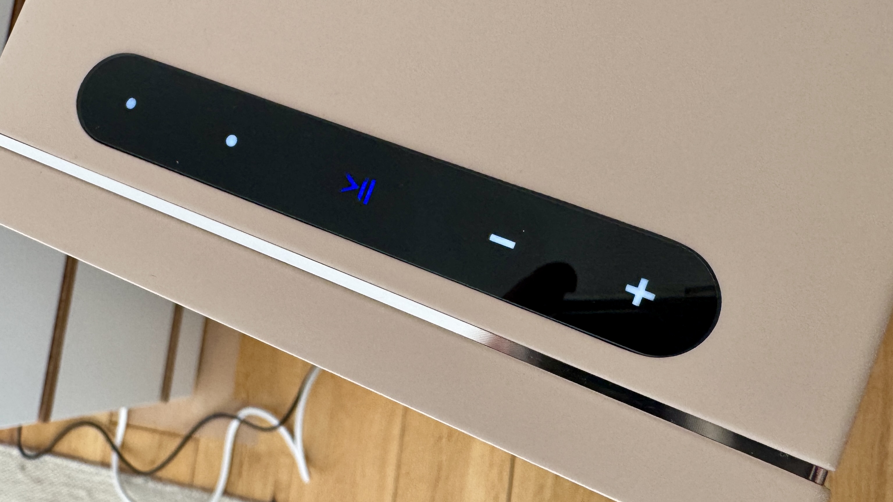 Top panel showing illuminated capicative buttons on the PSB iQ2 speaker system.
