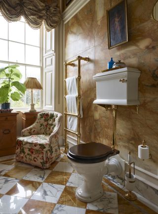 An antique style toilet with brass pipes
