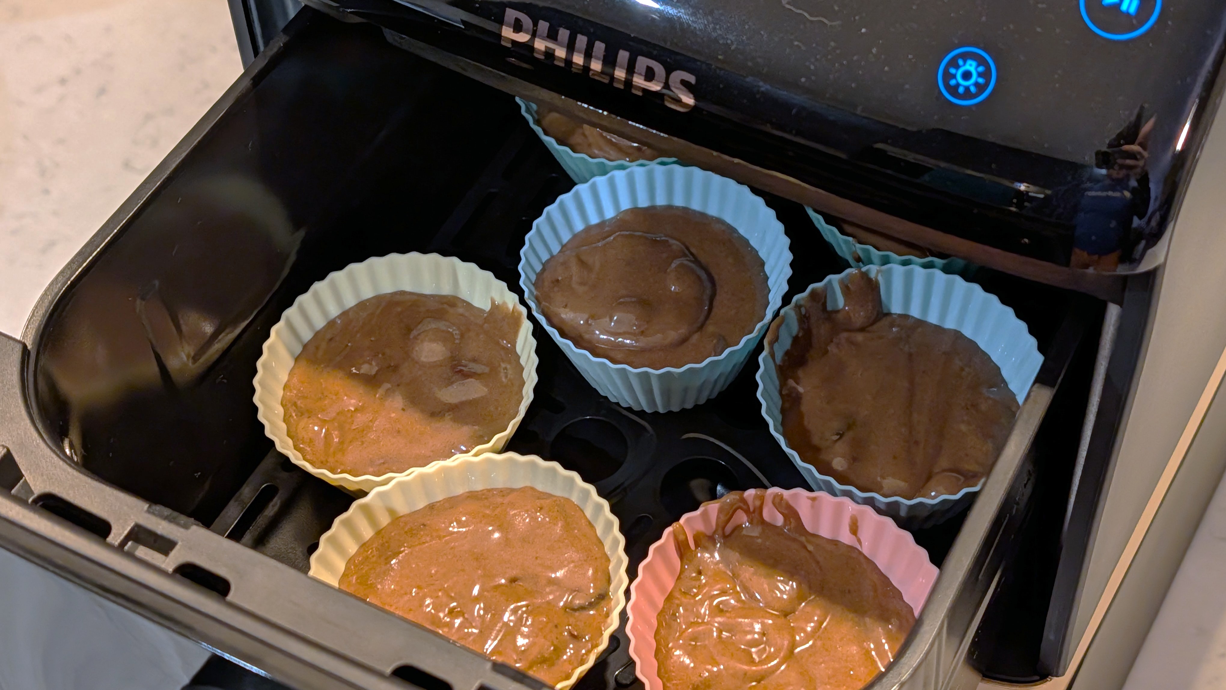 Uncooked muffins in Philips 4000 Series Airfryer drawer