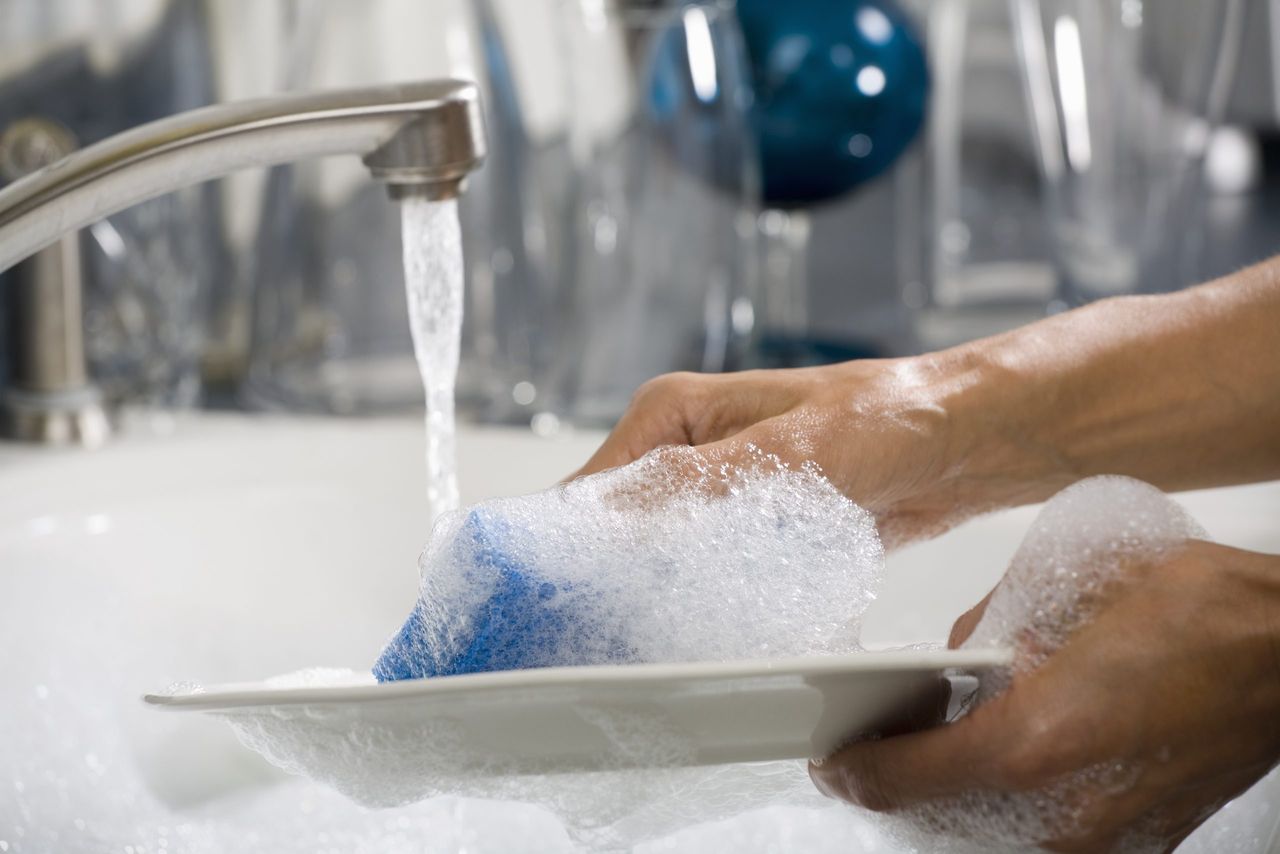 Jo Malone washing up liquid - pair of hands doing washing up with soapy water