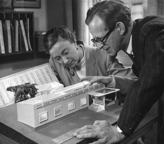 Jane Drew and Maxwell Fry looking at a model of an African school, 1945 (RIBA Collections)