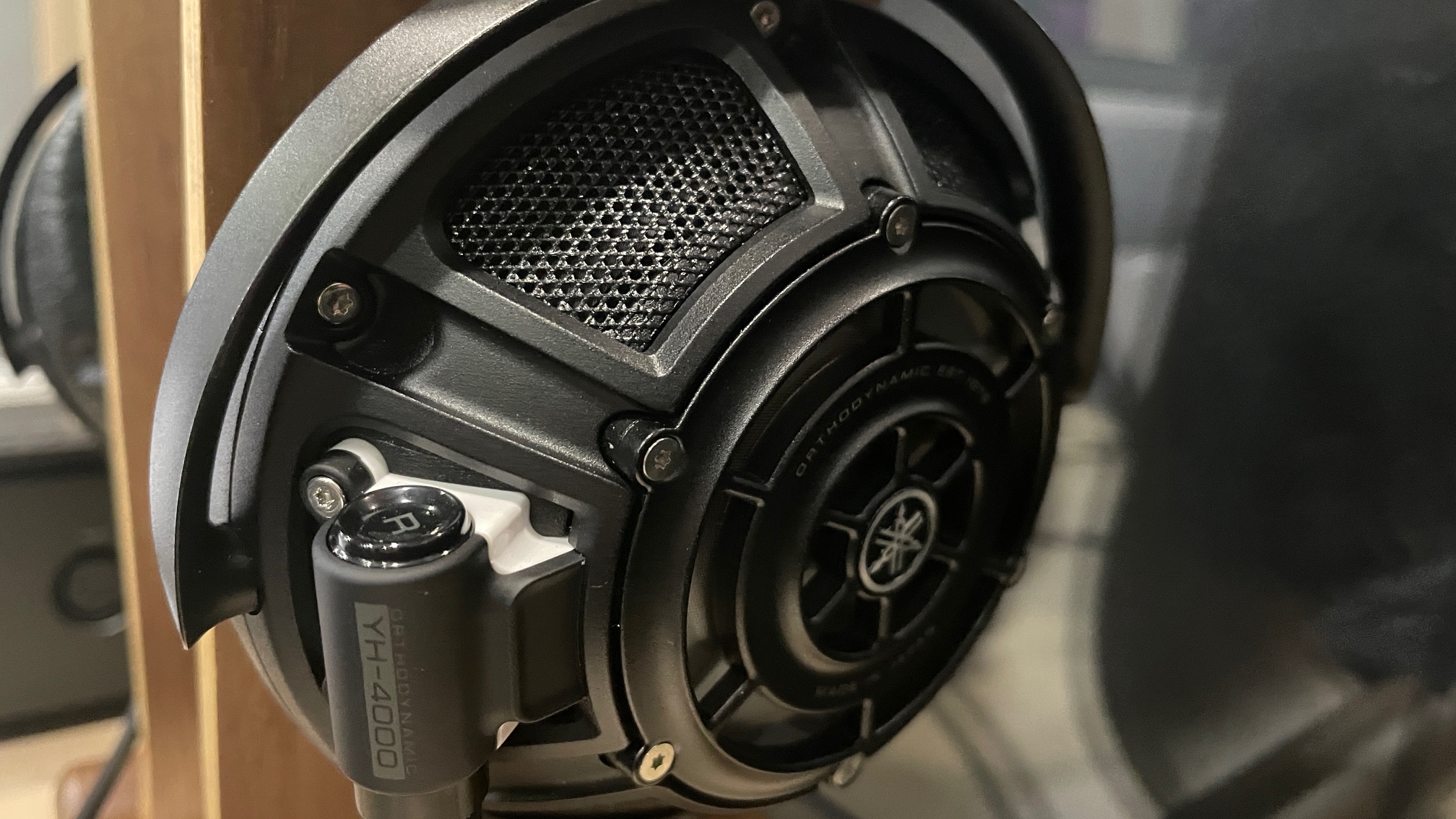 A selection of headphones, including the Audio-Technica ATH-ADX7000 worn by a man in Paris