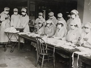 Nurses preparing masks to prevent the spread of influenza in 1918.