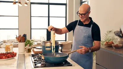 Stanley Tucci cooking in his kitchen with TUCCI by GreenPan