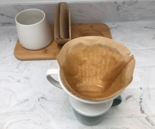 Melitta pour over coffee maker with filter paper saturated
