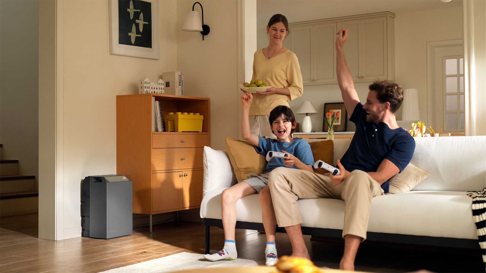 A father and son playing videogames powered by the EcoFlow STREAM 5000 solar battery system