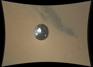 This color full-resolution image showing the heat shield of NASA's Curiosity rover was obtained during descent to the surface of Mars on Aug. 5 PDT (Aug. 6 EDT). The 15-foot heat shield was photographed by Curiosity's MARDI descent camera.