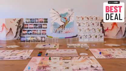 Wingspan box and components laid out on a table and plastic holders, with a 'best deal' badge in the top right corner