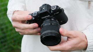 Fujifilm X-T50 camera held in two hands