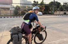 Woman on a bike with kit 