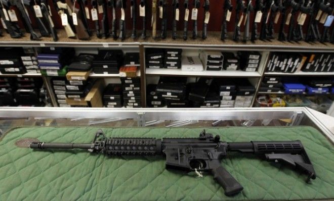 An AR-15 style rifle is displayed at the Firing-Line indoor range and gun shop in Aurora, Colo.