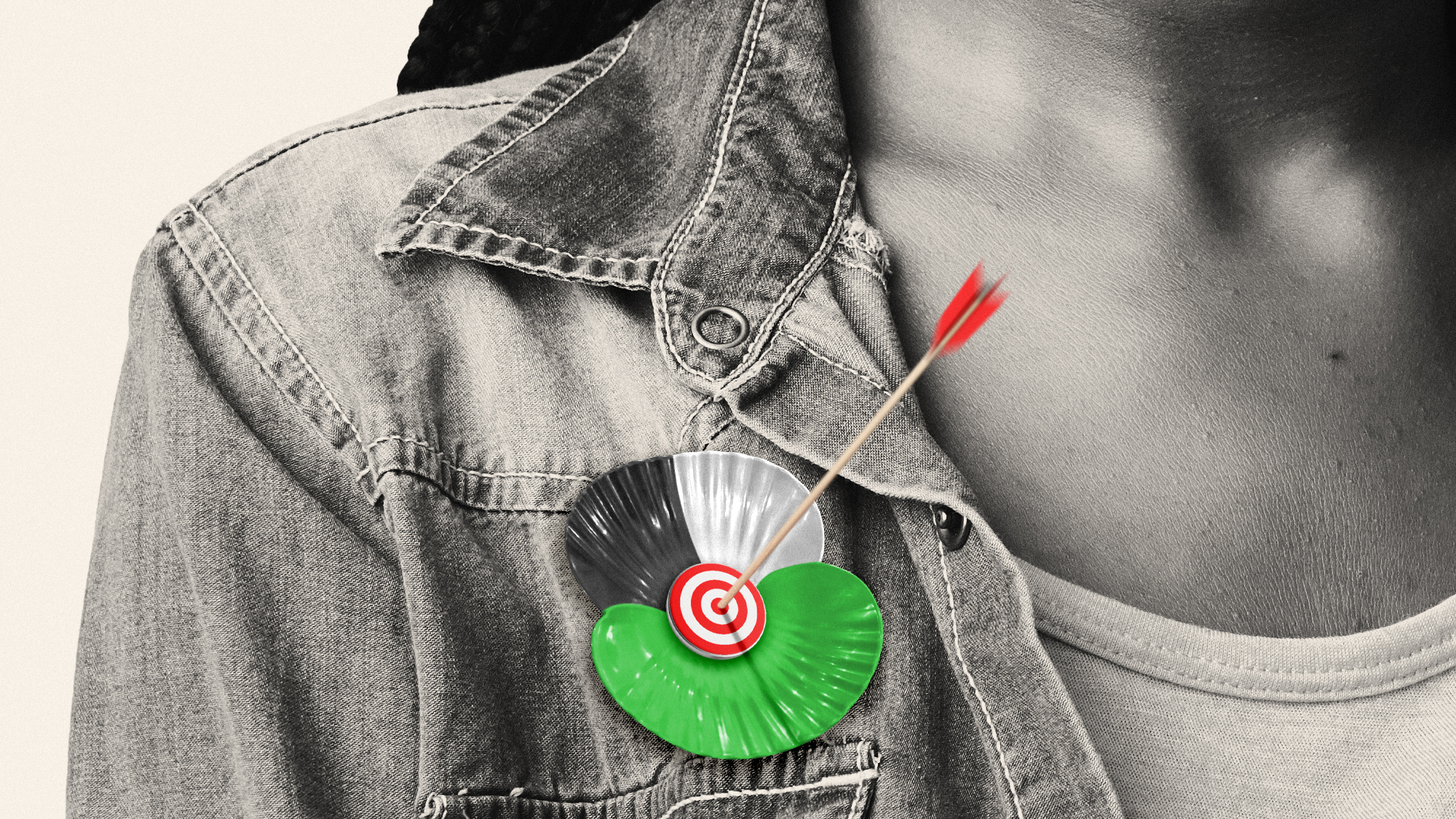 Illustration of a poppy brooch in Palestine colours, with a target and arrow at the centre