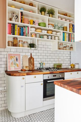 white shaker kitchen with open shelving and wooden countertops