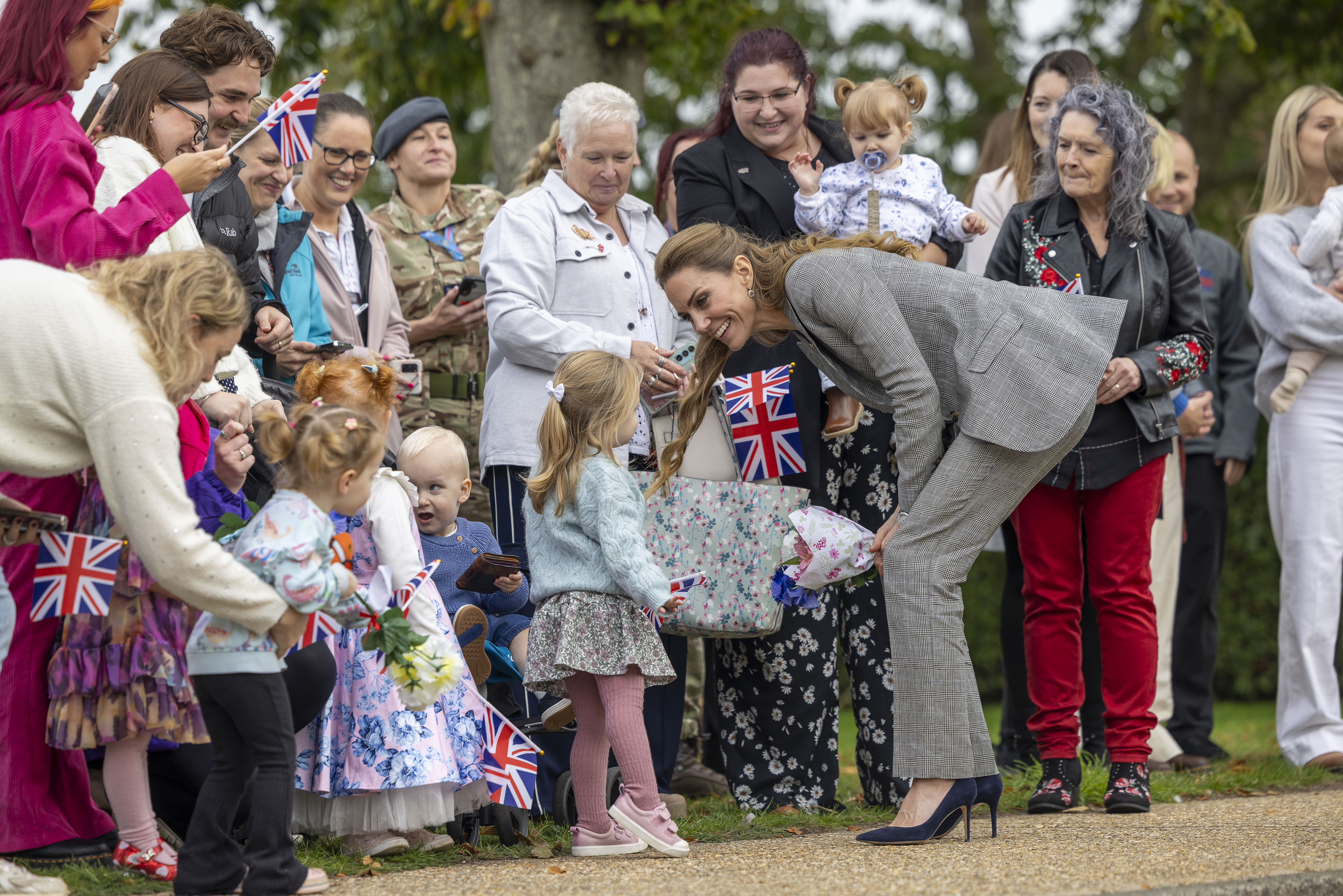 CONINGSBY, ENGLAND - OCTOBER 2: Catherine, Princess of Wales, Royal Honorary Air Commodore, meets families based at RAF Coningsby in Lincolnshire during her first official engagement at the station, on October 2, 2025 in Coningsby, England. During the visit, Her Royal Highness learned about the station&#039;s operational role, met Quick Reaction Alert personnel, viewed a Typhoon aircraft, and toured the new Typhoon Future Synthetic Training facility, and also met families of personnel serving at the base. (Photo by James Glossop - WPA Pool/Getty Images)