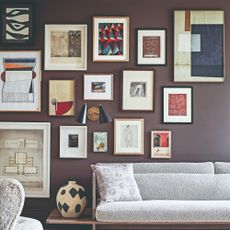 A living room with a large gallery wall