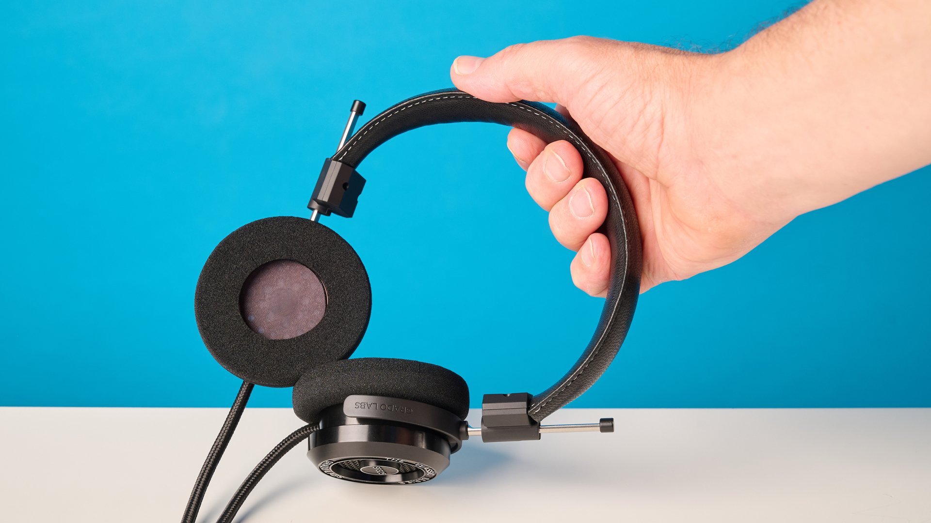 Grado SR325 photographed in front of a blue background