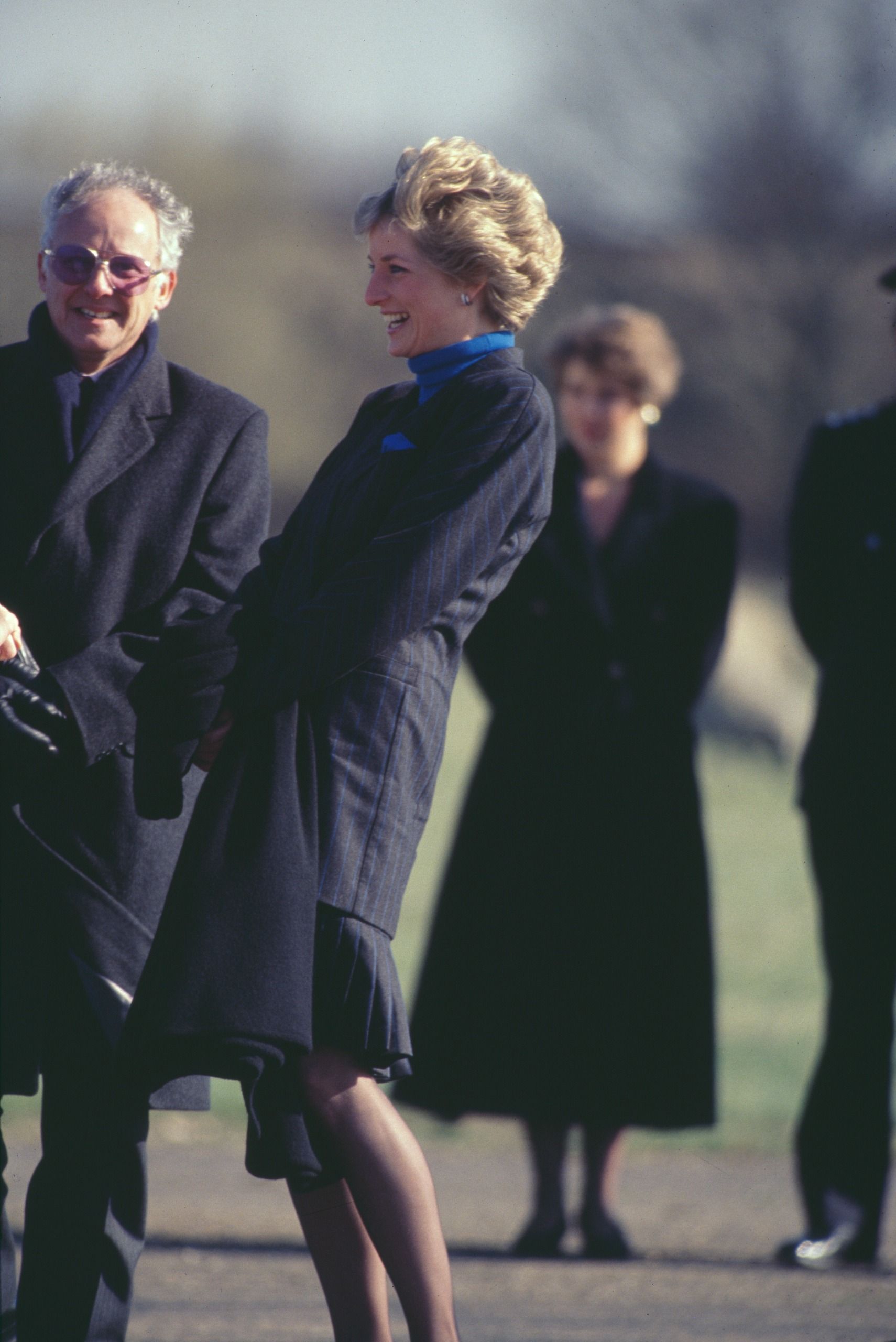 Princess Diana laughing standing next to Dickie Arbiter outside