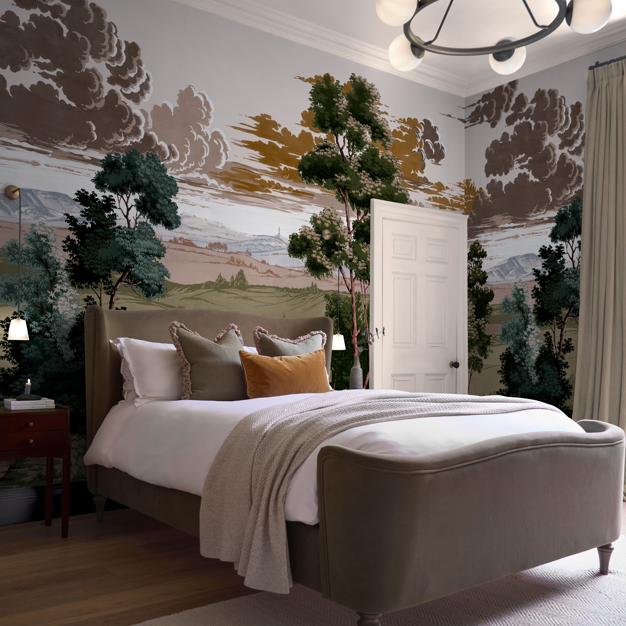 A bedroom with walls covered in Graham &amp;amp; Brown's Red Rose County mural with an upholstered brown velvet bed