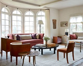 neutral living room with antiques and linen upholstery