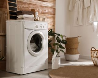 Stylish room interior with washing machine
