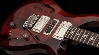A photo of the PRS S2 Special Semi-Hollow in Fire Red Burst finish
