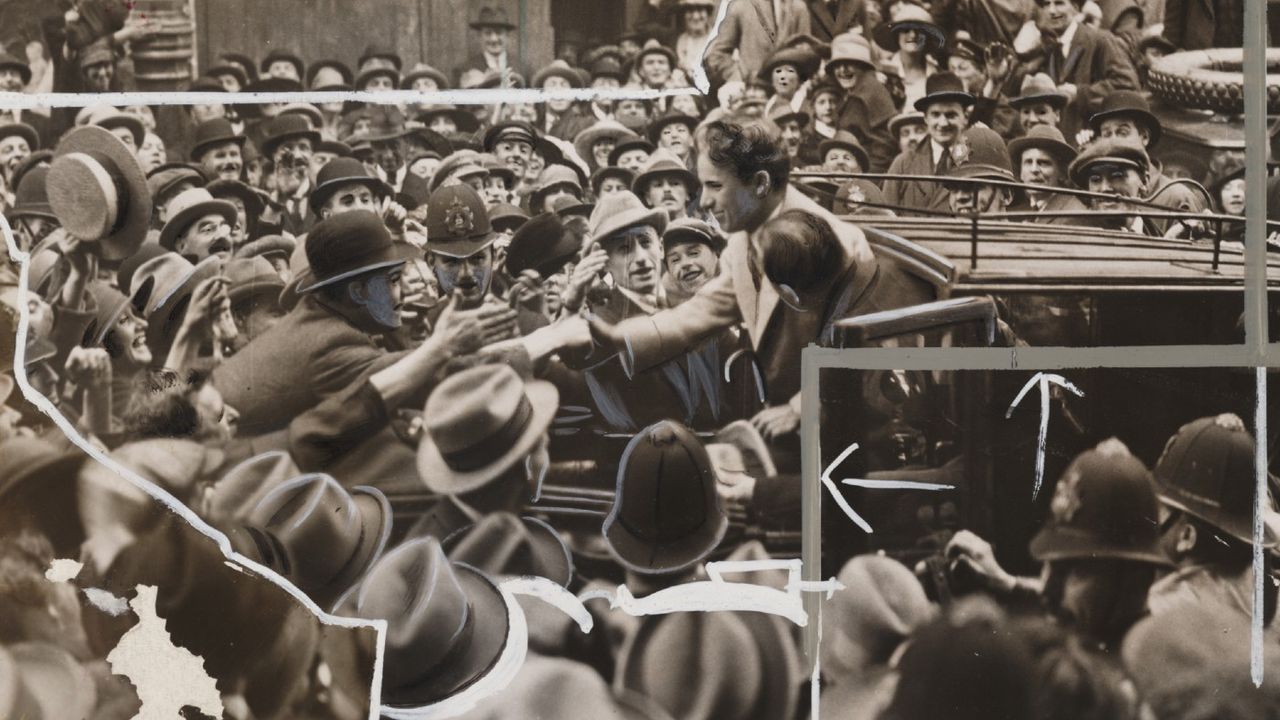 Charlie Chaplin surrounded by fans 