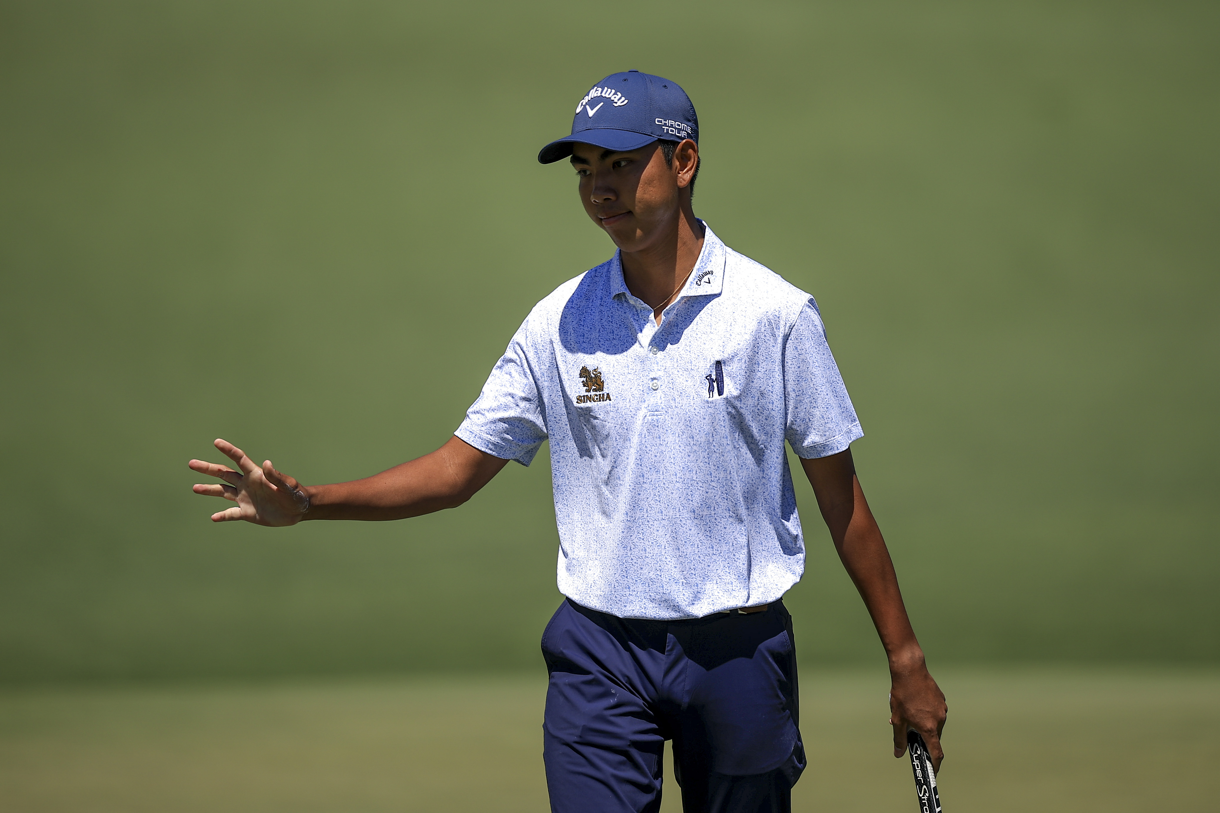 Amateur Fifa Laopakdee of Thailand reacts to a putt on the second hole during the first round of the 2026 Masters Tournament at Augusta National Golf Club on April 09, 2026 in Augusta, Georgia.