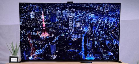 Sony A95L QD-OLED TV showing city image onscreen
