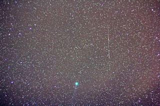 A ring of green light encircles Comet Lovejoy, in this image captured on Jan. 9, 2015, in Jadwin, Missouri. Amateur astronomer Victor Rogus used a 50mm manual focus Zeiss lens for a 36-second exposure.