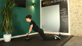 Personal trainer Alanah Bray performs kettlebell press-up