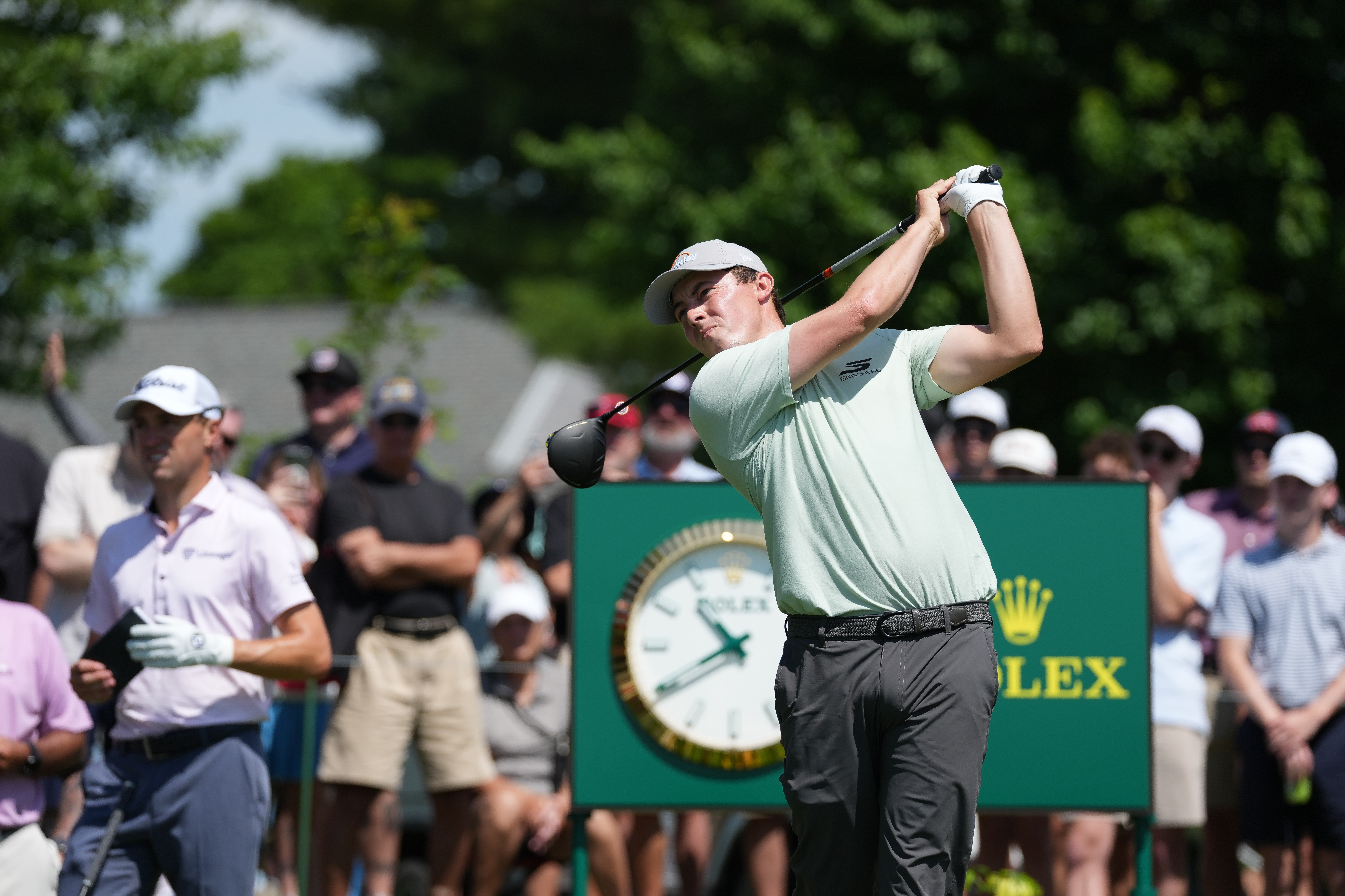 Matt Fitzpatrick holds his finish on a driver shot at the Travelers Championship