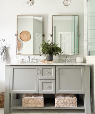 Gray and white bathroom with chrome hardware and rattan accessories