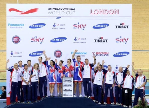 The British team of riders, coaches and helpers on the podium as GB won the team event in the London round of the UCI World Cup