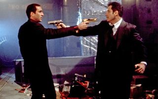 FACE /OFF 1997 Paramount Pictures film with Nicholas Cage at left and John Travolta