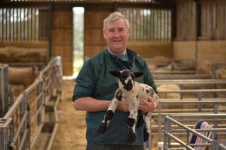 Vet Peter Wright with some lambs in The Yorkshire Vet 