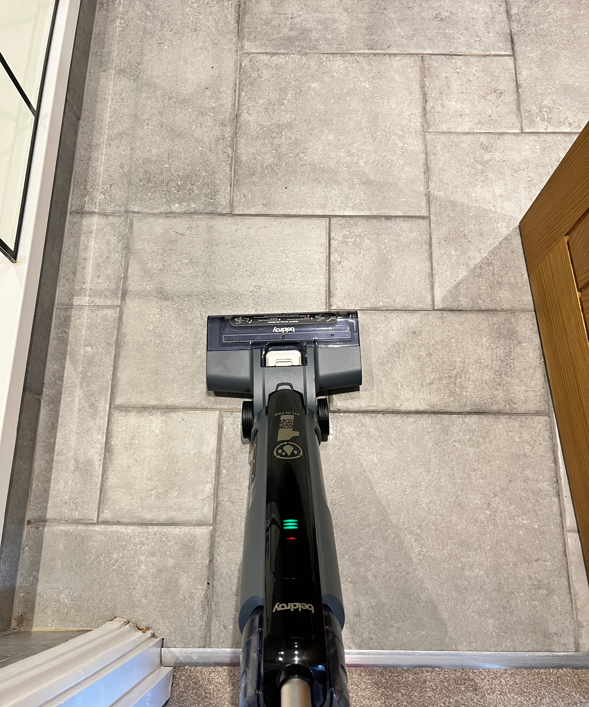 floor cleaner in use on tiled floor
