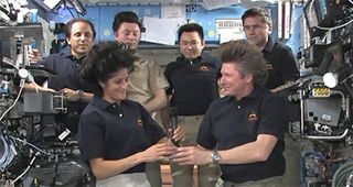 NASA astronaut Sunita Williams (front left) takes command of the International Space Station from cosmonaut Gennady Padalka (front right) during a ceremony marking the start of the Expedition 33 increment aboard the space station on Sept. 15, 2012.