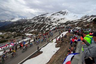 Spectators cheer as the pack rides in the ascent of the San Bernardino pass Switzerland during the 20th stage of the Giro dItalia 2021 cycling race 164km between Verbania and Valle Spluga Alpe Motta Madesimo on May 29 2021 Photo by Luca Bettini AFP Photo by LUCA BETTINIAFP via Getty Images
