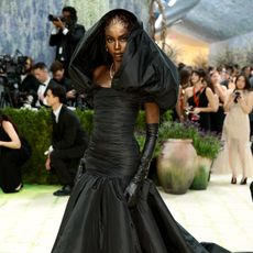 anok yai attending the met gala wearing robert kun